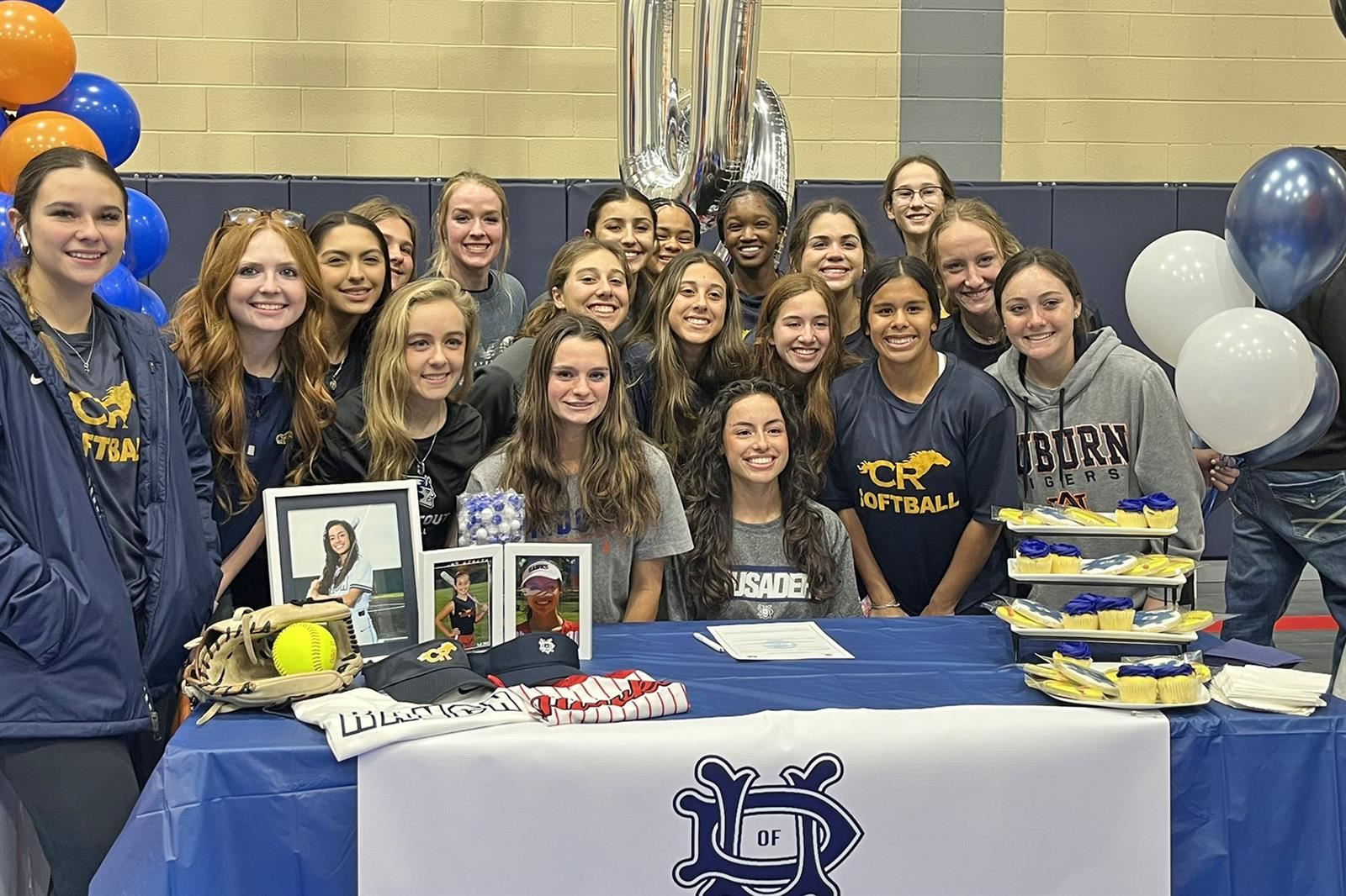 Cy Ranch High School senior Amarisa Garza, seated, signed her letter of intent to play softball at the University of Dallas.